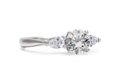 Brilliant Cut Solitaire With Pear Cut Shoulders Engagement Ring